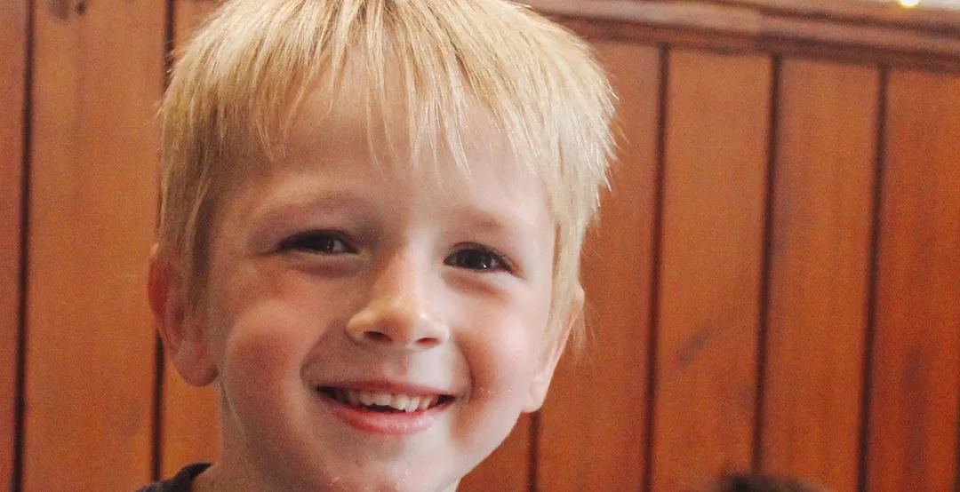 A smiling boy at Century Kids